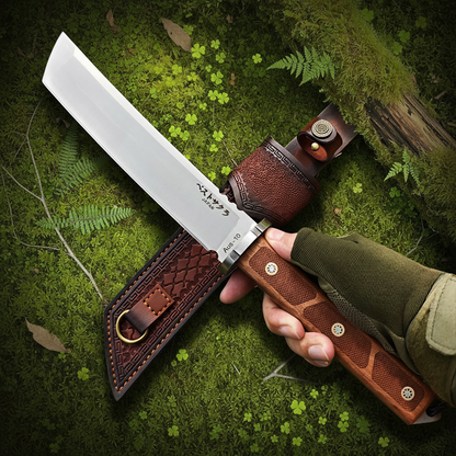 Hand holding AUS-10 knife template B forest moss