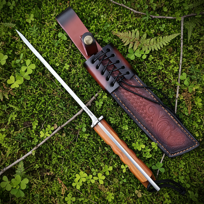 Stiletto knife forest floor moss background